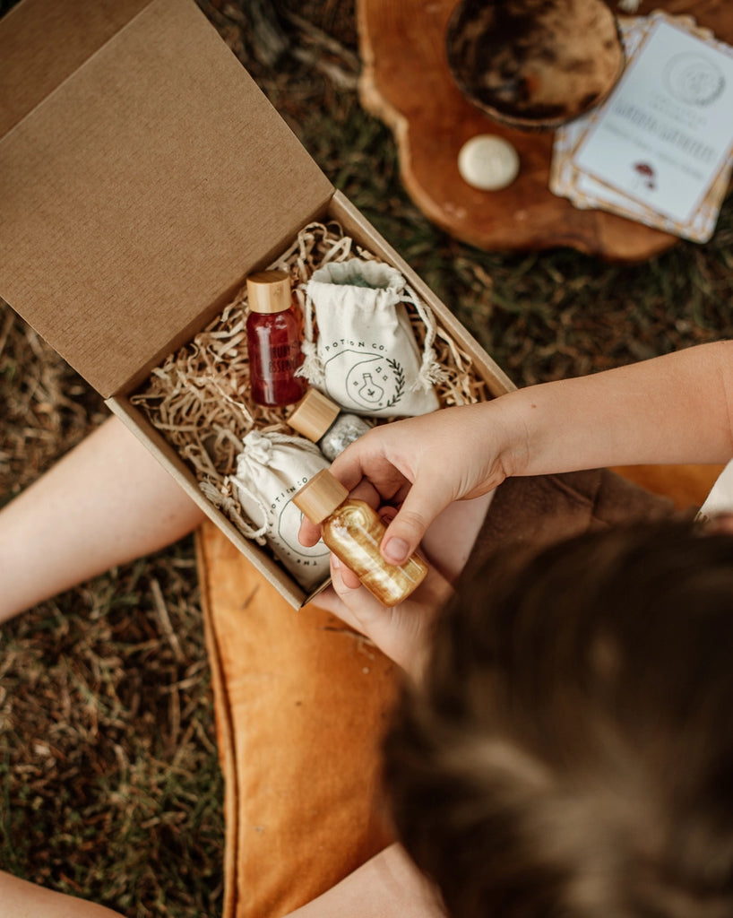 Little Potion Co Gnome Remedy Mindful Magic Potion Kit includes 3 liquids of vibrant colours and full of sparkles in PET bottles with bamboo lids. three bags of dry potion ingredients and one recipe card. Made in Austrailia